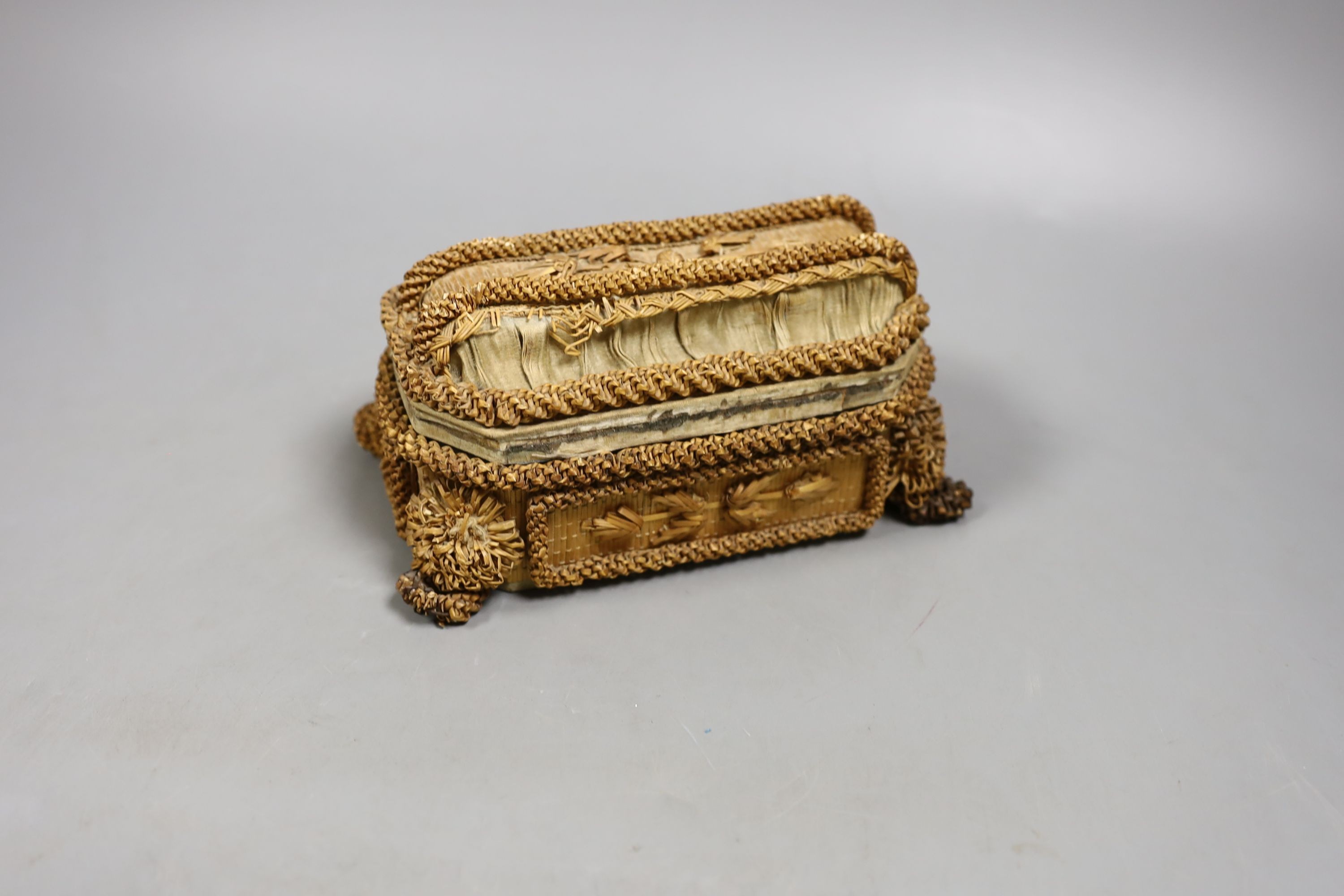 A small 19th century straw work casket., 17cms wide x 9cms high.
